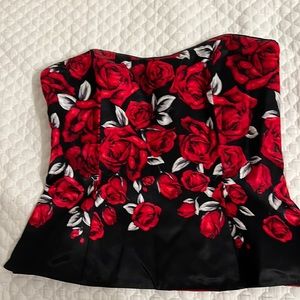 Black corset top with red roses.